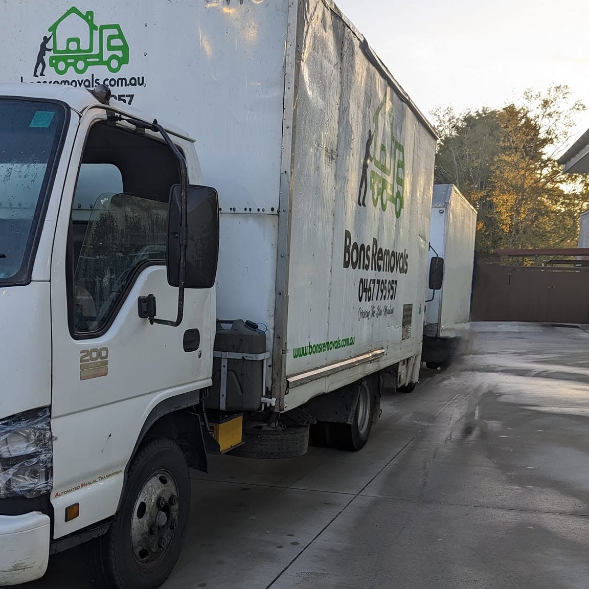 Close up of a Bons Removals truck cab and signage